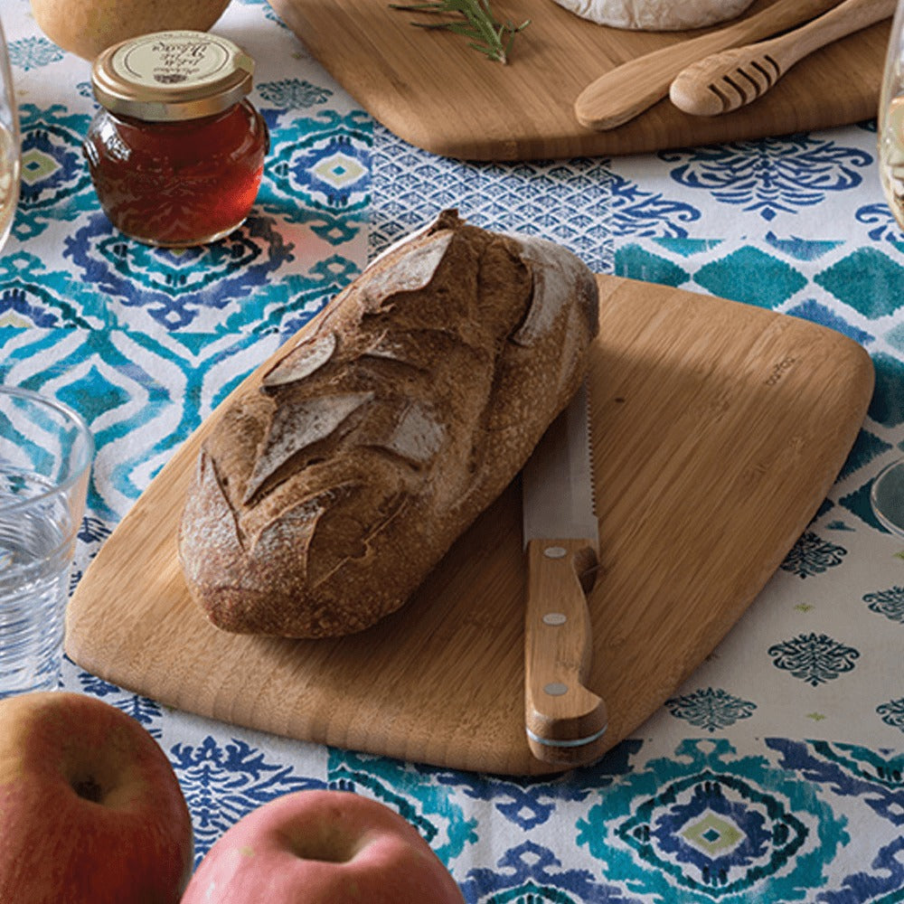 Organic Bamboo Large Cutting Board shown with a loaf of bread